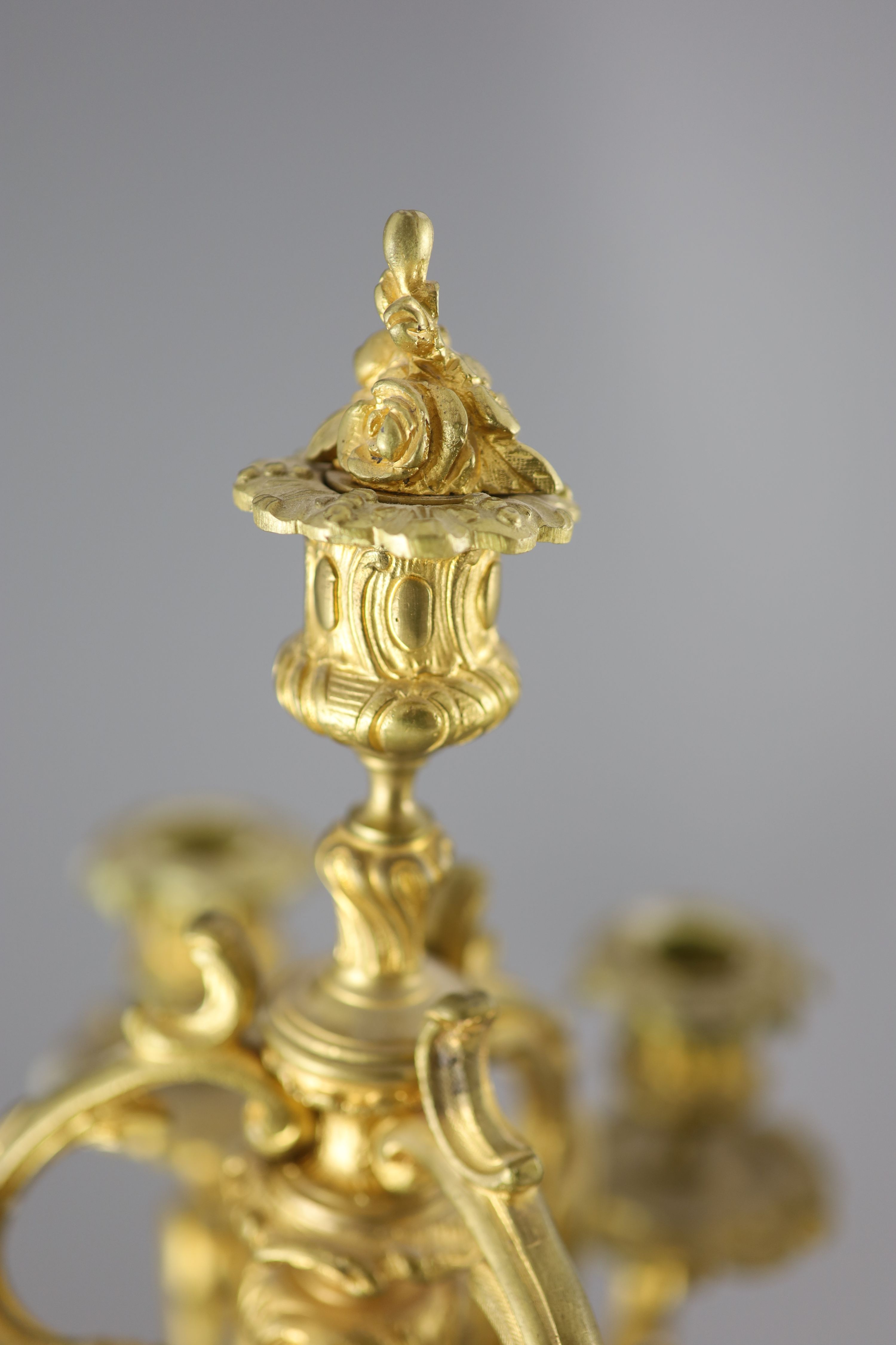 A pair of late 19th century French Louis XV style ormolu seven light candelabra, height 26in.